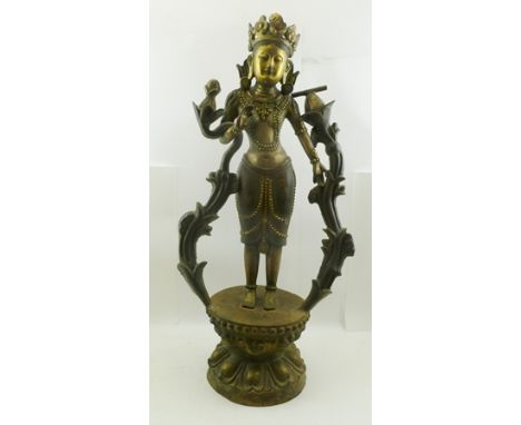 AN 18TH/19TH CENTURY BRONZE SINO TIBETAN STATUE TARA, traces of gilding, standing pose upon a lotus pedestal, bearing Dynasti