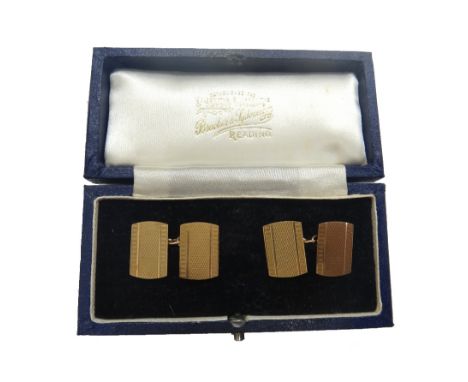 A pair of engine turned 9ct gold oblong cufflinks, hallmarked Birmingham 1979, by Deakin & Francis, 5.8gms combined (2).
