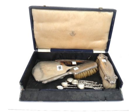 An engine turned silver mounted hand mirror, Birmingham 1942, matching hair brush and comb, initialled, an Art Nouveau silver