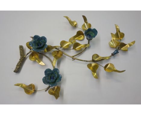 A contemporary gilt metal flowering branch wall decoration, circa 1970's, with ceramic flowerheads, 66cm high.