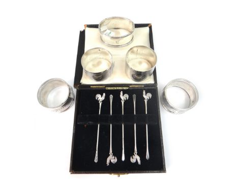 Five silver napkin rings, various dates, makers and designs, including a circular engine turned pair, Birmingham 1928, all in