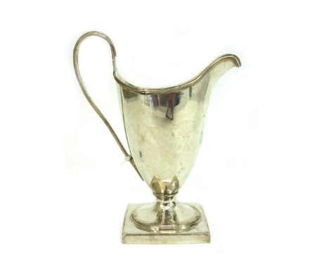 A George III silver helmet shape cream jug, London 1790, makers mark unclear, with threaded rim and handle, on a square plint