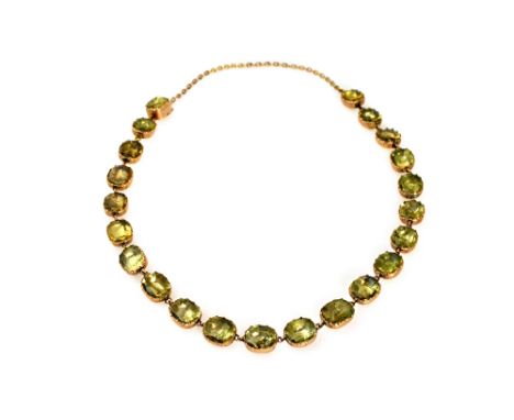An early 19th century gold and foil-backed quartz necklace, the twenty two oval and cushion shaped closed-back collets with l