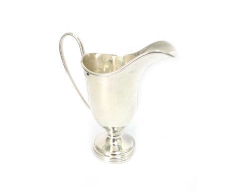 A George III style silver helmet cream jug, Wakeley & Wheeler, Dublin 1915, 13cm high, 4ozs.