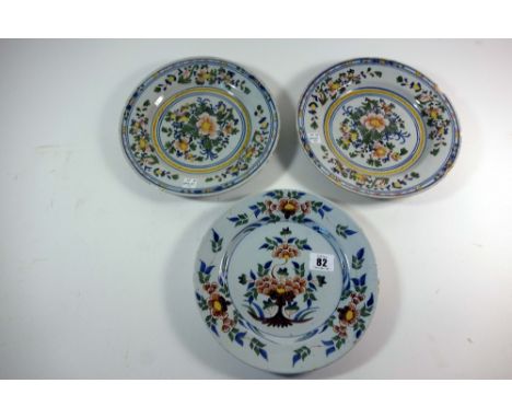 A Bristol polychrome delftware plate, circa 1760, painted in the centre with a flowering shrub, the border with three flower 