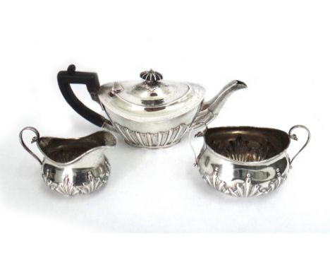A bachelors late Victorian silver teapot, James Deakin & Sons, Sheffield 1899, oval, part lobed and fluted and a late Victori