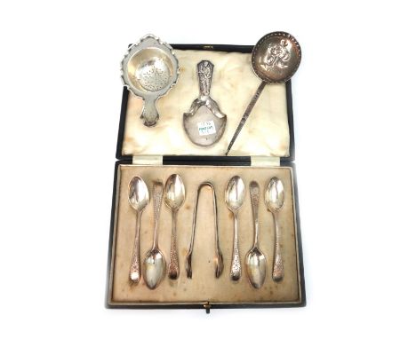 A cased set of six Edwardian silver coffee spoons and sugar tongs, John Round, Sheffield 1907, foliate engraved, a silver tea