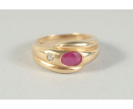 A 14CT GOLD RUBY AND DIAMOND SNAKE RING.