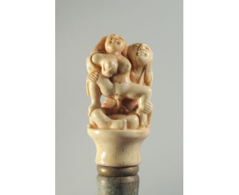 A CARVED BONE HANDLED WALKING STICK "EROTIC".