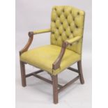 A GREY LEATHER ARMCHAIR.