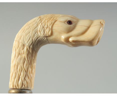 A CARVED BONE HANDLED WALKING STICK "DOG".