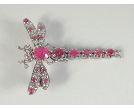 A GOLD BACKED SILVER SET, RUBY AND DIAMOND DACHSHUND BROOCH.