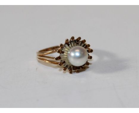 A cultured pearl ring, yellow metal, size E, 3gms gross approx, unmarked