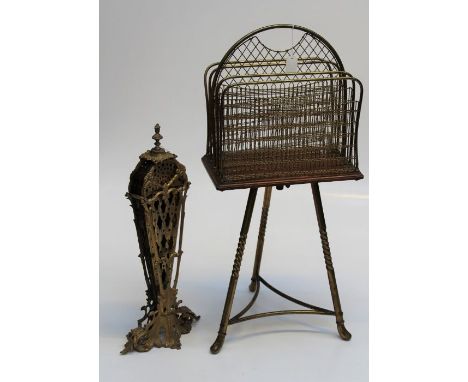 An Edwardian brass and mahogany revolving magazine stand, together with a brass peacock firescreen on scrolled Rococo base