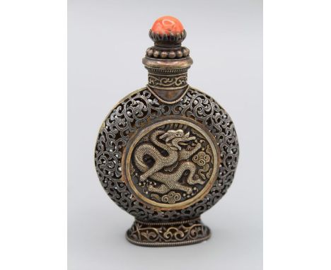 Chinese snuff bottle.Mongolian parcel gilded white metal, of moon flask form, on high flared foot, each of the two main sides