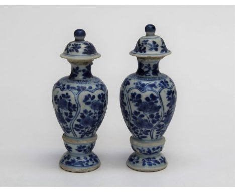 A pair of Vung Tau Cargo dwarf covered vases, China, circa 1690. Each florally decorated in underglaze blue. 13cm high. R and