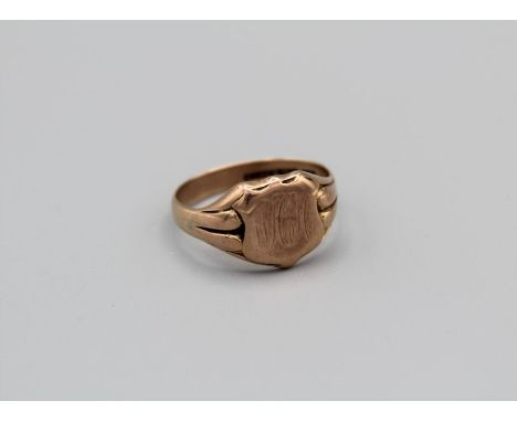 A rose yellow metal initialed signet ring, stamped 9ct, gross weight approximately 7gm