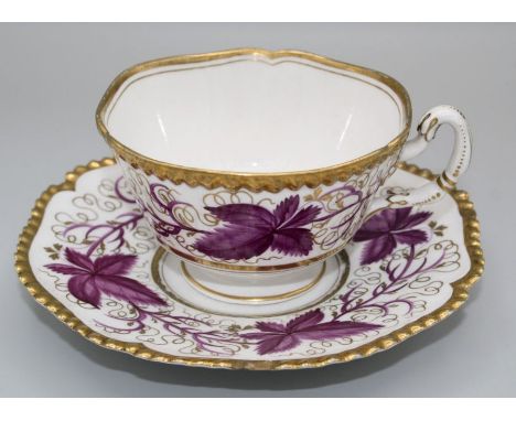 An early 19th century Worcester, Flight Barr and Barr teacup and saucer, decorated overglaze with puce vine leaves within a g