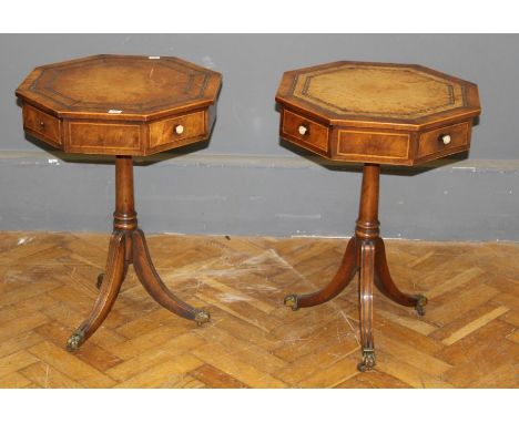 A pair of good quality reproduction mahogany lamp tables, each having octagonal crossbanded, tooled hide set top over four fr