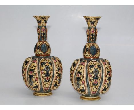 Zsolnay, Pecs, a pair of early 20th century reticulated vases of bombe onion form, decorated in pastel shades with gilding. 2