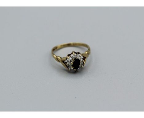 A sapphire and cubic zirconia 9ct gold ring, gross weight 1.5gm, size J1/2