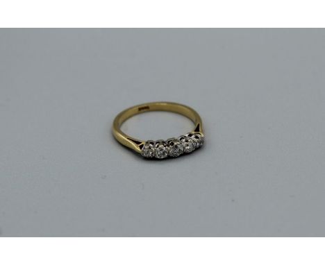 A five stone diamond ring in yellow metal stamped 18ct, gross weight approximately 3.2gm, size N