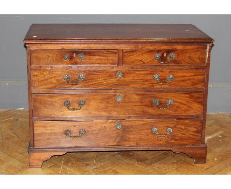 A George III mahogany chest, the crossbanded rectangular top over two short and three long graduated drawers with florally ca