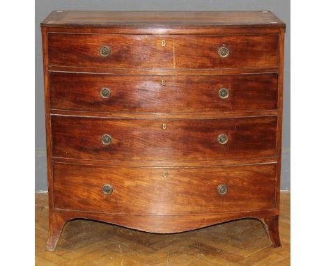 An early 19th century mahogany chest of bow front form, the crossbanded top over four graduated long drawers, with brass ring