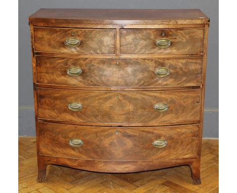 An early Victorian mahogany veneered bowfront chest, having two short and three long drawers fitted with later handles, raise