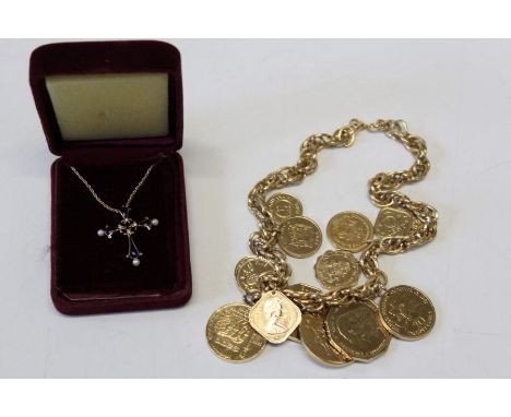 A Franklin mint midnight sapphire cross from the House of Igor Carl Faberge in 14ct yellow gold on a twisted rope chain, also