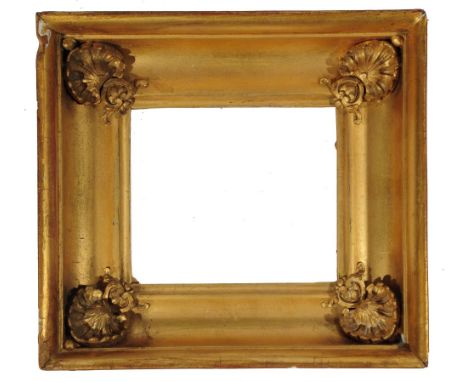 A 19TH CENTURY MINIATURE FRAME of rectangular form, the cushion moulded concave border with shell spandrels, rebate size 17 x