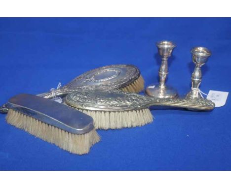 LOT OF SILVER DRESSING TABLE ITEMS
including a beo-classical enbossed hand-mirror, a plain clothes brush, a dwarf candlestick