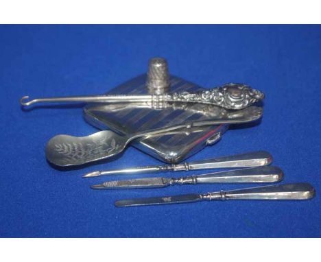 SILVER CIGARETTE CASE
together with silver handled manicure accoutrements, silver handled button hook, silver thimble, Afghan