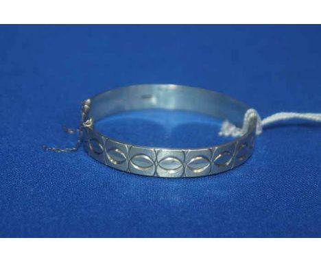 SILVER BANGLE BY MONOMILS
decorated with an overlapping circles decoration