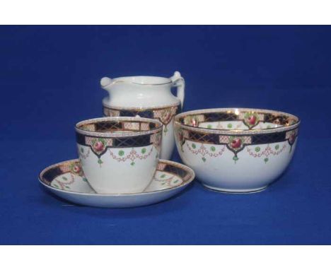 ROYAL ALBION CHINA TEA SERVICE
decorated with roses set within a trellis, on an ivory ground, factory mark to base 