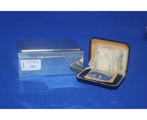 SILVER CIGARETTE BOX
engine turned design to lid, 13cm long; together with a Ronson ladies silver plated lighter, in original