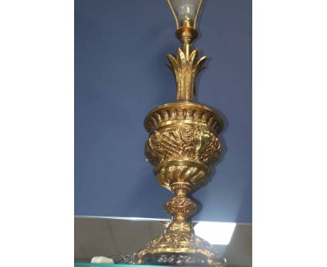 LARGE CAST BRASS TABLE LAMP
of urn form on circular plinth base with four paw feet, palm design top, 73cm high