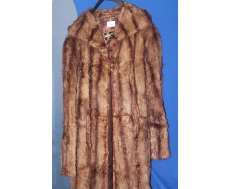 LADY'S VINTAGE MUSQUASH FUR COAT
bearing interior label for 'Faulkes Furriers' of Birmingham