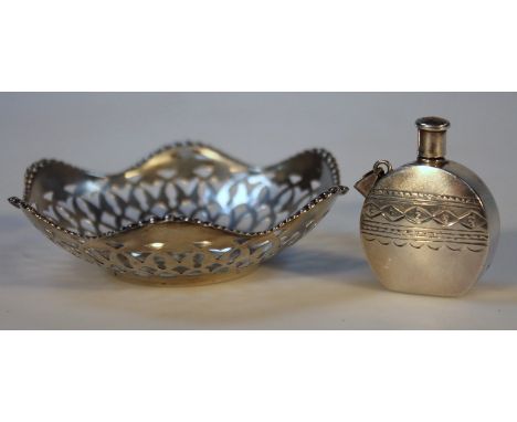 A George V silver pin dish, by Henry Matthews, of floral form with a pierced bow and bead border, on a circular foot, Birming