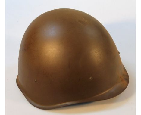 A post war steel infantry helmet.