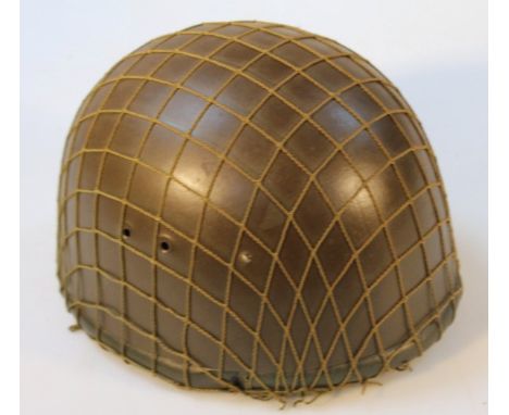 An East German steel tank crew helmet.