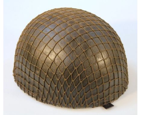 A British paratrooper's steel helmet.