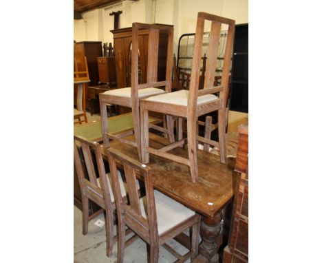 An limed oak drawer leaf refectory table, of good proportion the rectangular top, raised on baluster columns joined by heavy 