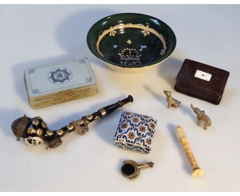 Various bygones, to include a 19thC needle case calendar, a miniature pressed leather stamp box, elephant and dog charm, deco