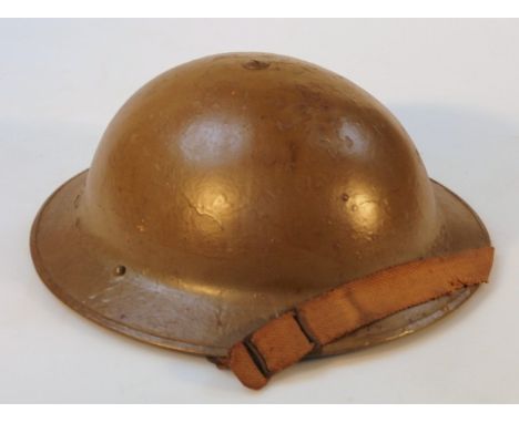 A British Army Type II steel helmet.
