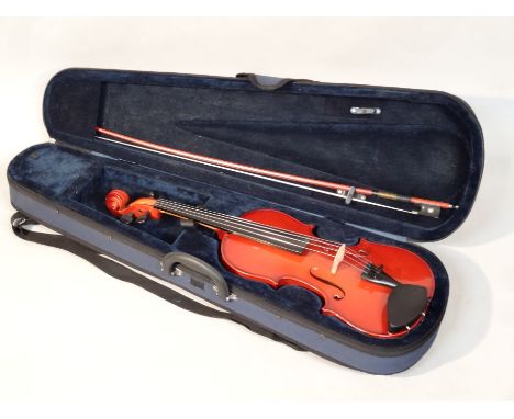 A Mayflower practice violin, with a two piece back, ebonised fittings, 59cm with a bow with nickel end fitted in a modern car