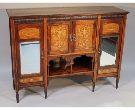 An Edwardian rosewood and inlaid side cabinet, the moulded top raised above a gadrooned frieze and double cupboard and open s