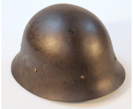 A WWII period steel helmet.