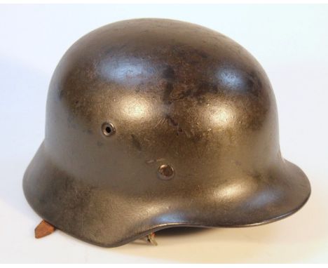 A WWII period German steel infantry helmet.