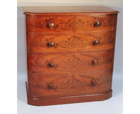 A Victorian mahogany bow fronted chest, of two short and three long cock beaded drawers, 112cm high, 110cm wide, 56cm deep.